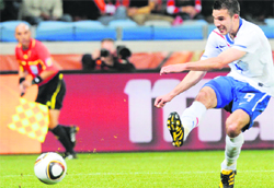Netherlands striker Robin van Persie scores during their match against Cameroon in Cape Town 