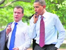 US President Barack Obama and Russian President Dmitry Medvedev walk through Lafayette Park in Washington on Thursday. 
