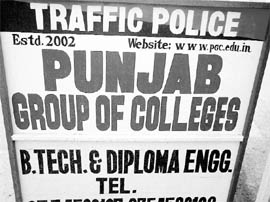 Advertisements of private institutions displayed on police barricades at Dera Bassi