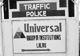 Advertisements of private institutions displayed on police barricades at Dera Bassi