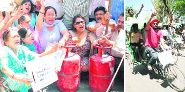 BJP activists protest against rise in prices of petrol and diesel at Chawni Chowk in Jammu on Saturday; and (right) members of the Kranti Dal take out a rickshaw rally