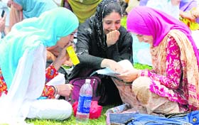 Girls go through their notes before taking the Common Entrance Test in Srinagar