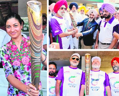 Alka Lambha, convenor Queens Baton Relay Organising Committee of the 2010 Delhi Commonwealth Games ( 2) DGP PS Gill hands over the baton to former athlete Jagdev Singh; and (3) weightlifter Parvesh Chander, hockey stalwarts Sukhvir Grewal, Balbir Singh and Hardeep Singh Neeta with the baton in Ludhiana on Saturday. 