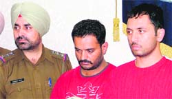 The main accused in Vikramjits murder case Jagminder (first from right) and Rajinder (centre) in police custody in Ludhiana. 
