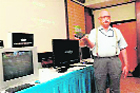 A company official displays a home computer in Hyderabad
