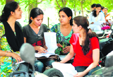 Students in front of the UGC examination centre at Panjab University in Chandigarh on Sunday.
