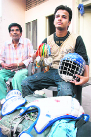Ankush Gupta with his father at his residence in Jammu on Sunday.