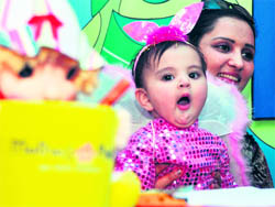 A mother and her child during a bady show at Mothers Pride School in Ludhiana 