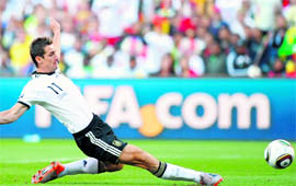 German striker Miroslav Klose scores the opening goal during their World Cup match against England in Bloemfontein on Sunday