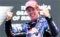 Sebastian Vettel celebrates on the podium of the Valencia Street circuit on Sunday after the Formula One Grand Prix of Europe. Vettel won the race ahead of Lewis Hamilton and Jenson Button
