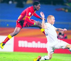 Ghanas striker Asamoah Gyan (L) scores against the USA during extra time of their match in Rustenburg on Saturday