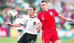Germanys Miroslav Klose (left) vies for the ball with Englands John Terry during a World Cup second-round 