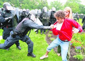 Policemen detain protesters during a demonstration at the G-20 summit in Toronto