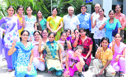 Topper students with college staff.