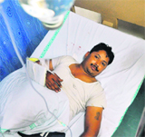 A security guard, who was injured in an attack, at the CMCH in Ludhiana on Monday.