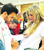 Spains midfielder Cesc Fabregas signs an autograph in Pochefstroom on Sunday.