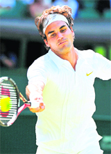 Roger Federer plays against Austrias Jurgen Melzer during the Wimbledon Championships on Monday.