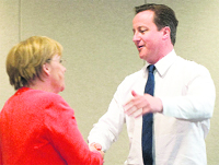 German Chancellor Angela Merkel being congratulated by British Prime Minister David Cameron after the match between England and Germany at the G20 summit in Toronto on Sunday.