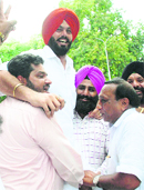 Supporters celebrate with reinstated president of the Municipal Council Rajinder Singh Rana in Mohali on Wednesday. 