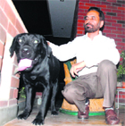 Col Gurnek Singh Toor (retd) with the Labrador dog at his house in Sector 12, Panchkula.