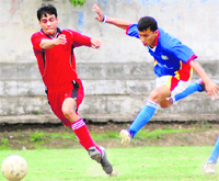 A match in progress at the Lala Nemi Dass Dehradun Football League in Dehradun