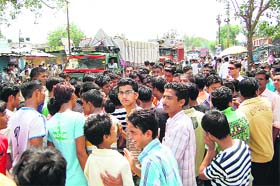 Villagers and shopkeepers block National Highway-72 near Selaqui in protest against frequent power cuts