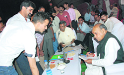Chief Minister Prem Kumar Dhumal hears public problems at Baijnath.
