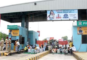 Members of the Anti-Toll Committee, Punjab, protest at a toll plaza at Kathgarh in Nawanshahr