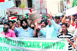 Members of the PDPs youth wing protest against the rise in prices of essential commodities in Jammu on Tuesday