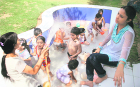 Children enjoy during summer camp at a Jammu school.