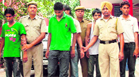 The accused in police custody on Wednesday. A Tribune photograph