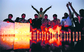 Activists of the ABVP light candles to pay tributes to the CRPF soldiers, who were killed in a Naxalite attack in Chattisgarh, at Panjab University in Chandigarh on Wednesday