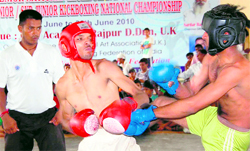 Players in action during a fight at the 5th Senior and 3rd Junior and Sub-Junior National Kickboxing Championship in Dehradun on Wednesday