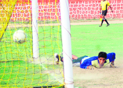 A goalkeeper fails to save a goal at the Dehradun Football League on Wednesday
