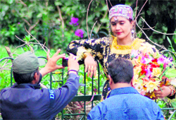 A tourist poses as a hill belle in Nainital