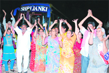 Amarnath pilgrims chant religious hymns before leaving the Yatri Niwas base camp in Jammu on Wednesday