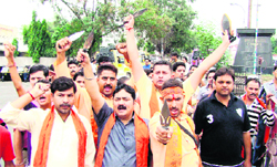 Activists of the Bajrang Dal protest against attacks at Anantanag on buses ferrying Amarnath pilgrims in Jammu on Wednesday. 