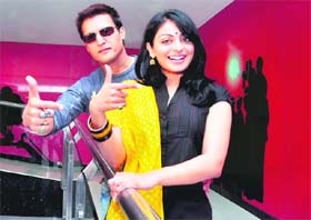 Jimmy Shergill and Neeru Bajwa strike a pose during the promotion of their forthcoming film “Mel Karade Rabba” at Waves Multiplex in Ludhiana