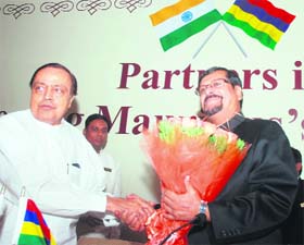 Union Minister for Petroleum and Natural Gas Murli Deora shakes hands with Minister of Commerce and Industry of Mauritius Showkut Ally Soodun during the signing of an agreement between MRPL and STC, Mauritius, in New Delhi