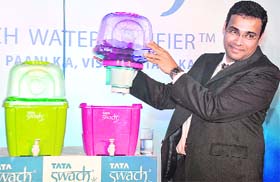 R Mukundan, managing director, Tata Chemicals Ltd., displays Swach Smart Magic, the latest variant of Swach brand of water purifiers, at its launch in New Delhi