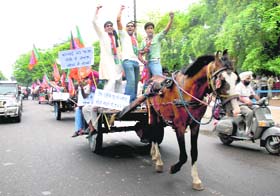 BJP activists take out a horse cart rally in Chandigarh