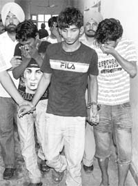 The accused in a robbery incident being produced in court at Dera Bassi