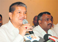 Union Minister of State for Labour and Employment Harish Rawat addresses a press conference in Dehradun