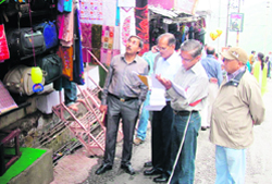 Musosorie SDM Manoj Kumar inspects encroachment on the Mall Road in Mussoorie