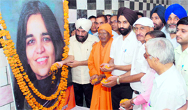 People pay tributes to Kalpana Chawla on her birth anniversary in Karnal on Thursday.
