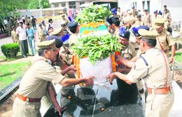 CRPF officers and jawans carry the body of constable Tilak Raj, who was killed in the Maoist attack at Narayanpur in Chhattisgarh, at the Jammu Airport on Thursday.