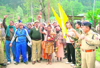 Mithilesh Kumar, Commandant, 164 Battalion of the CRPF, flags off the first jatha of Amarnath pilgrims onto the Pahalgam route from the Nunwan base camp in Kashmir on Thursday. 