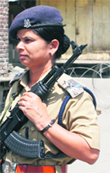 A policewoman officer patrols a street near Pathar Masjid in Srinagar on Thursday. Photo: Amin War