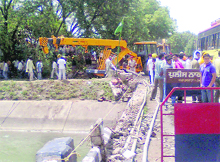 A machine in service to pull out a truck that plunged into the Mukerian Hydel Canal near Hazipur on Thursday