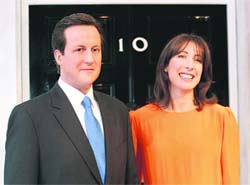 HEs NOT THE ONE: Samantha Cameron, wife of Britains Prime Minister David Cameron, poses with wax statue of her husband at Madame Tussauds in London on Thursday.